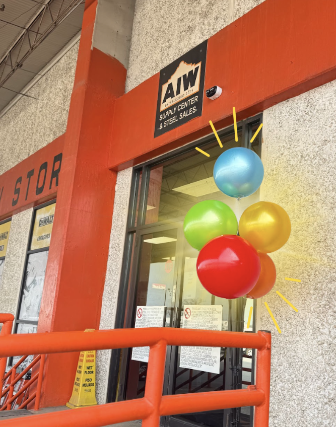 Colorful balloon cluster outside a store entrance with an &ldquo;AIW Supply Center & Steel Sales&rdquo; sign above the door.